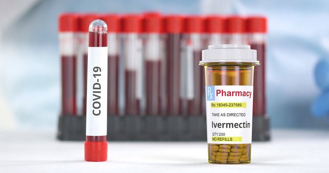 Ivermectin pills and test tubes - enlarge